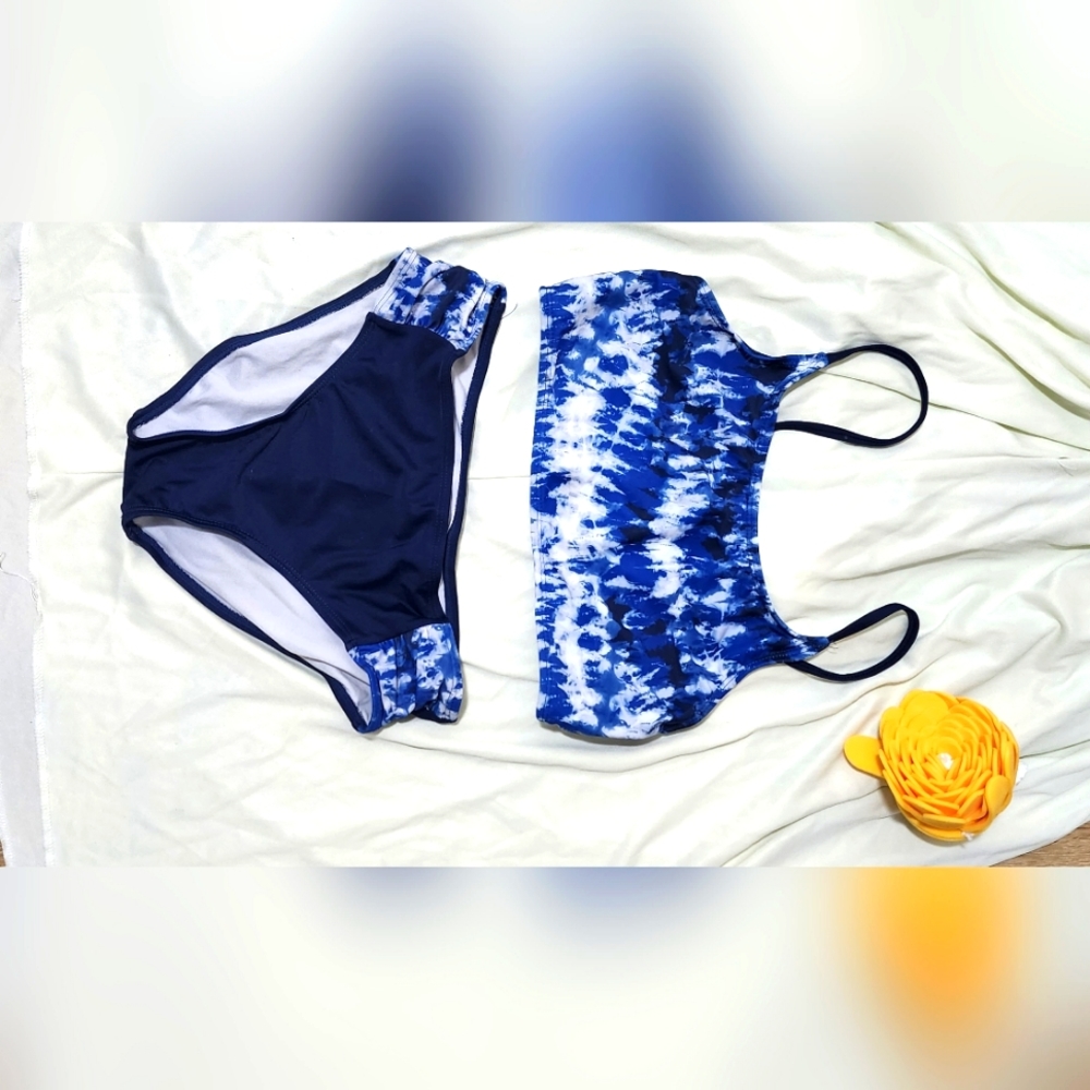 Girsl two-piece blue tye-dye swimsuit.